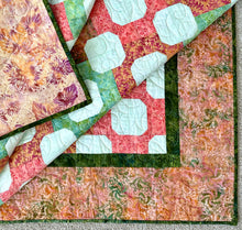 Load image into Gallery viewer, Peach and Green Batik Finished Quilt 61.5&quot; x 69.5&quot;